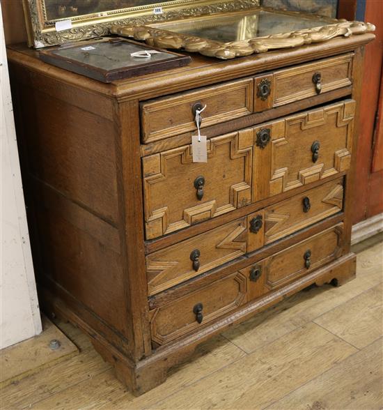 A 1920s Jacobean revival oak chest